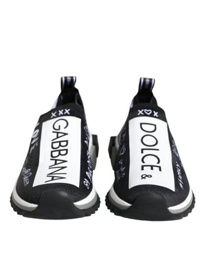 Black and white knit slip-on sneakers with D&G logo branding and white graphic text on a rubber sole.
