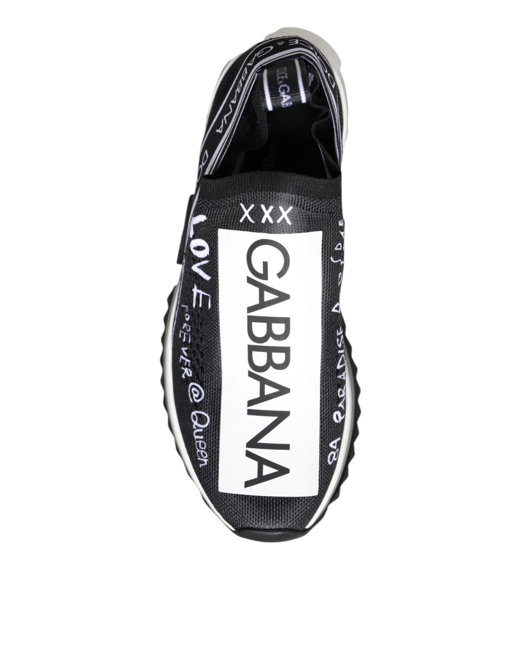 Dolce & Gabbana black and white slip-on sneaker in mesh fabric with white graffiti-style logo and text graphics.