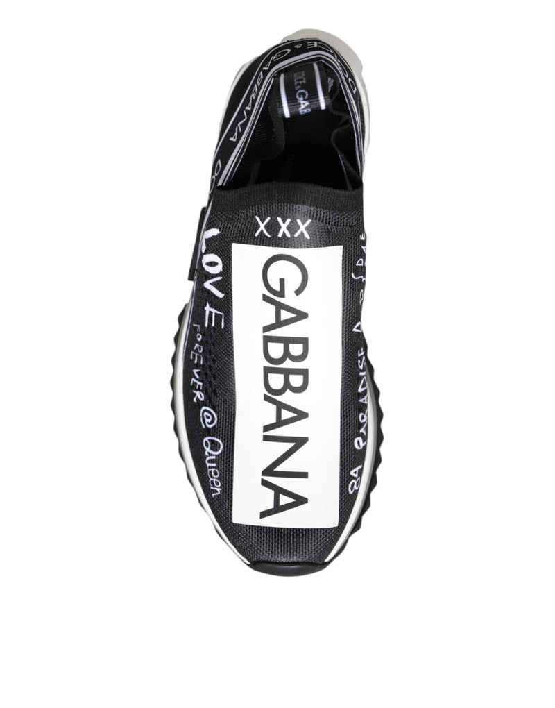 Dolce & Gabbana black and white slip-on sneaker in mesh fabric with white graffiti-style logo and text graphics.