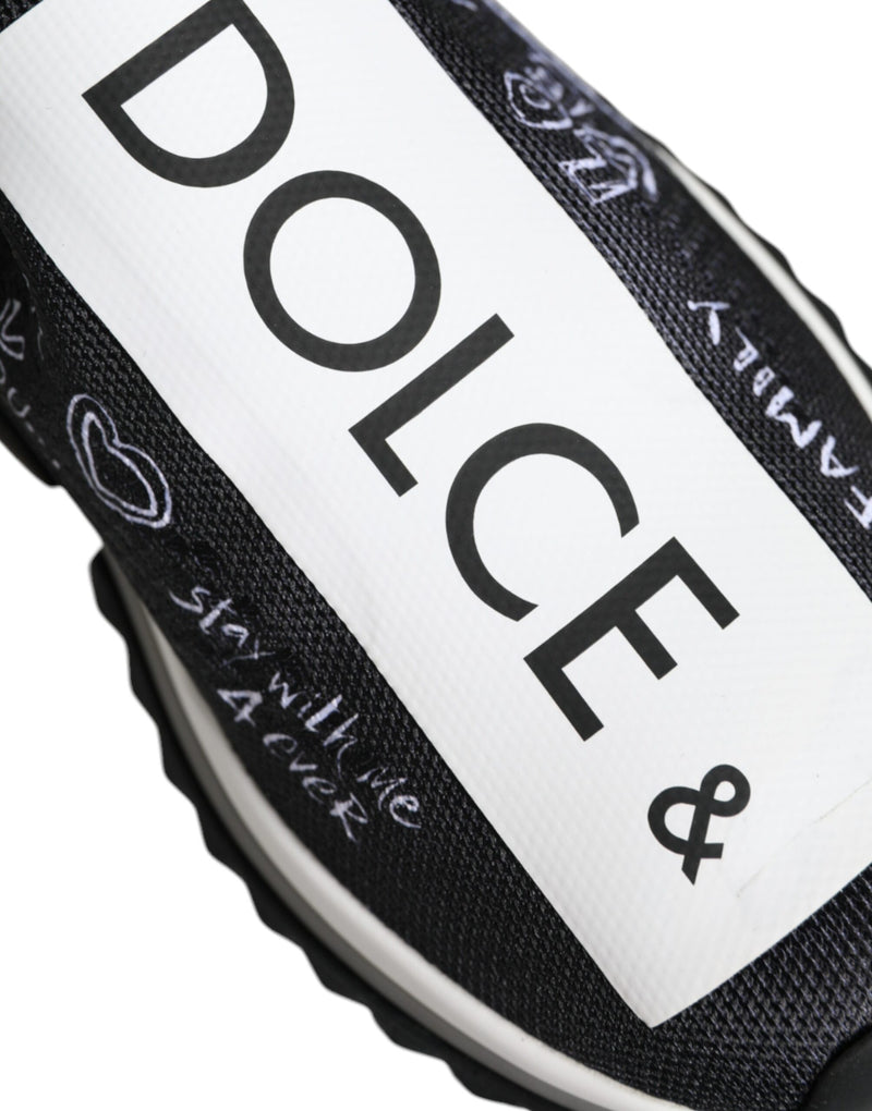 Black and white stretch knit Dolce & Gabbana Sorrento slip-on sneaker with graffiti-style text and heart graphics.