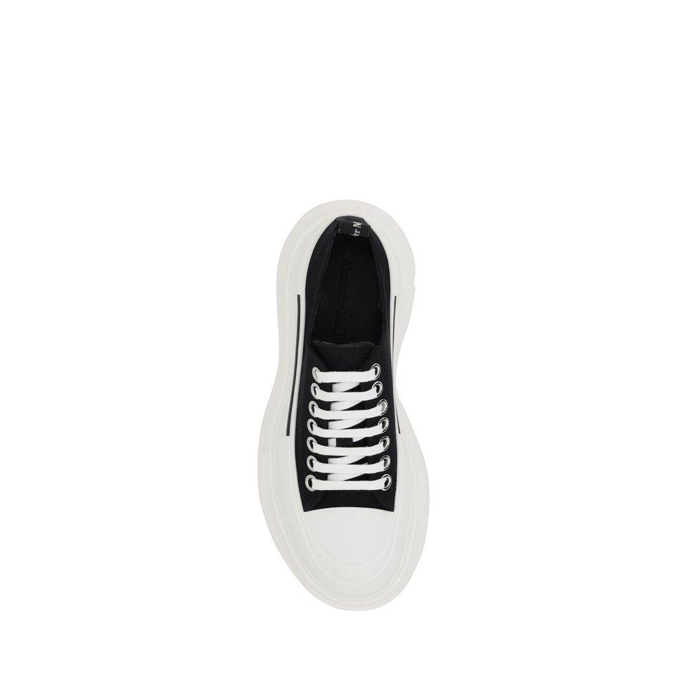 Alexander McQueen black cotton chunky sneakers with a white oversized rubber sole and white laces.