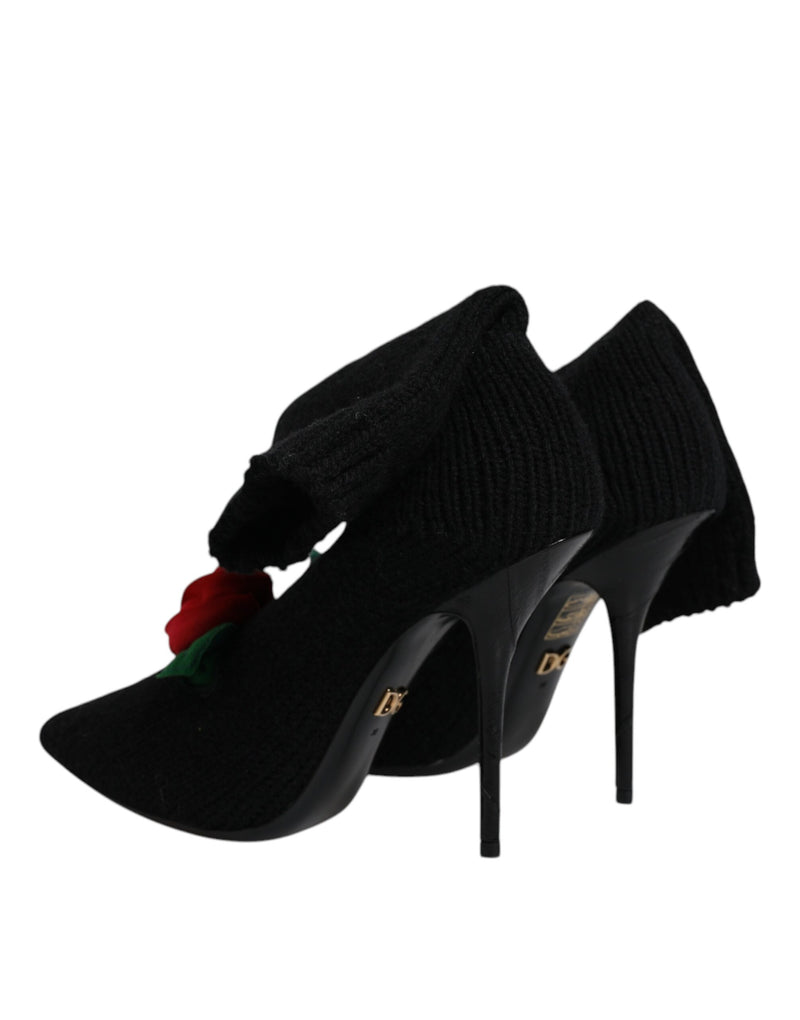 Dolce & Gabbana black knit mid-calf stiletto boots featuring a red fabric rose detail and gold hardware.