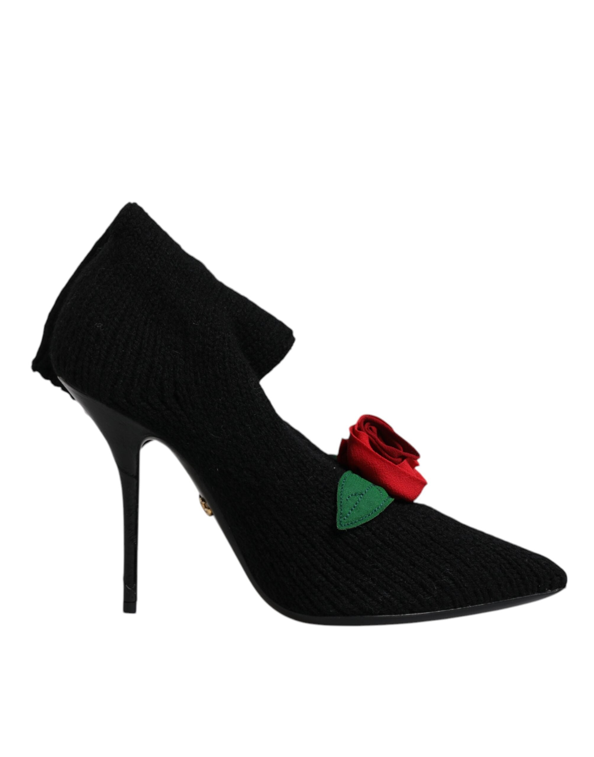 Black ribbed knit mid-calf stiletto boot with a pointed toe and a decorative red rose appliqué.