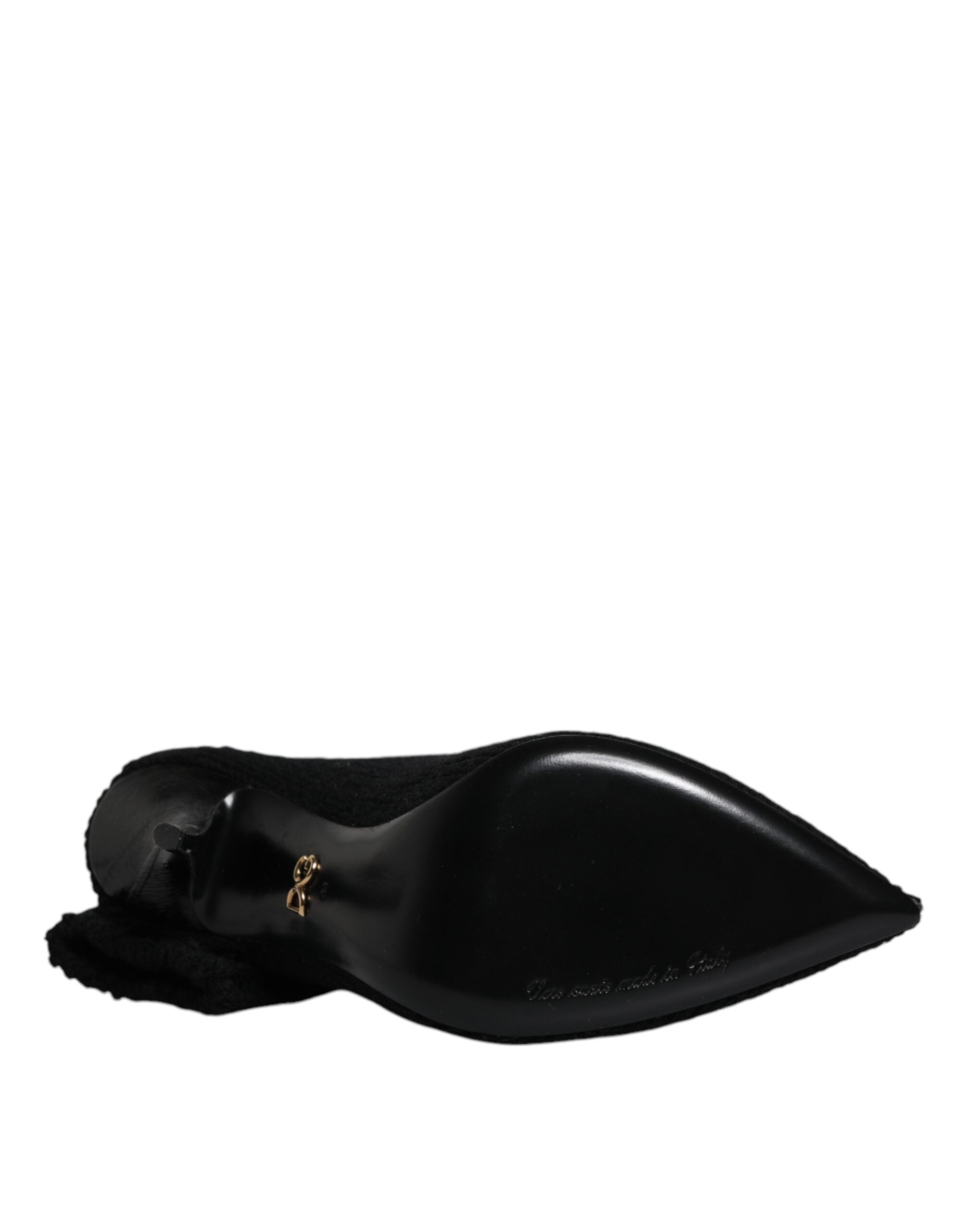 Dolce & Gabbana black textured mid-calf stiletto boot, featuring a sleek pointed toe and branded gold heel hardware.