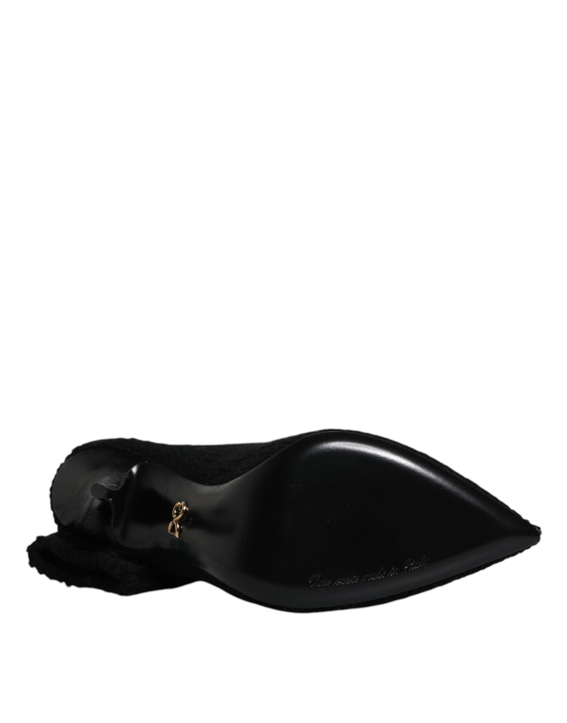 Dolce & Gabbana black textured mid-calf stiletto boot, featuring a sleek pointed toe and branded gold heel hardware.