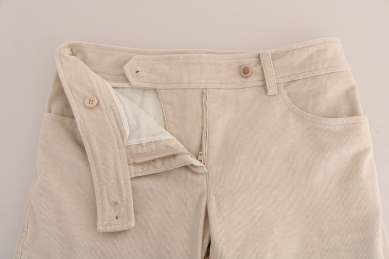 Beige corduroy skinny pants with a button fly closure