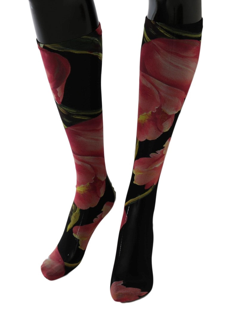 Black sheer nylon knee-high socks featuring a vibrant pink and red floral tulip print