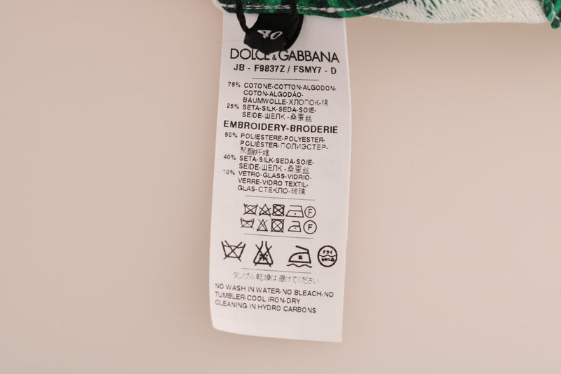 White Dolce & Gabbana garment tag showing fabric composition and care instructions