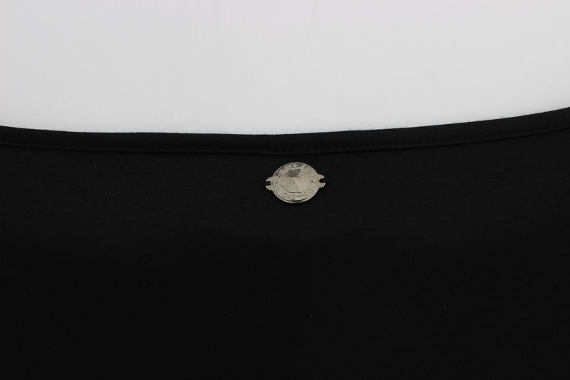 Black modal silk shift knee dress featuring a small silver brand logo tag on the neckline