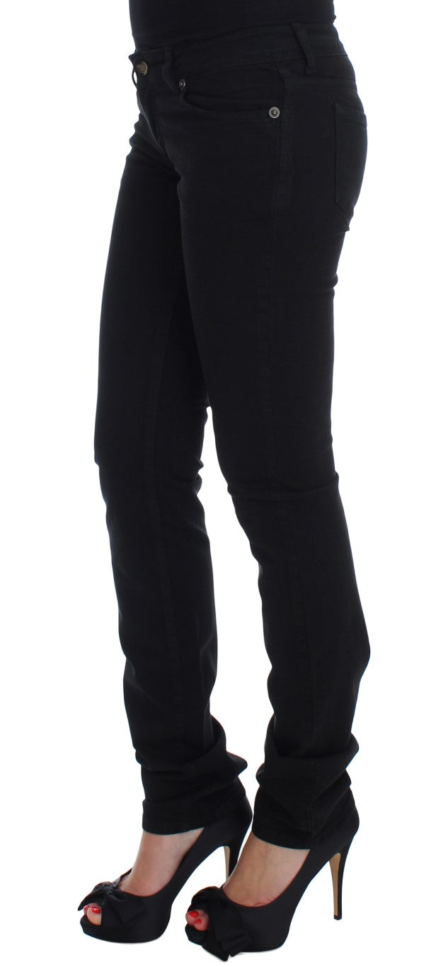 Black cotton stretch slim skinny fit jeans worn with black heels