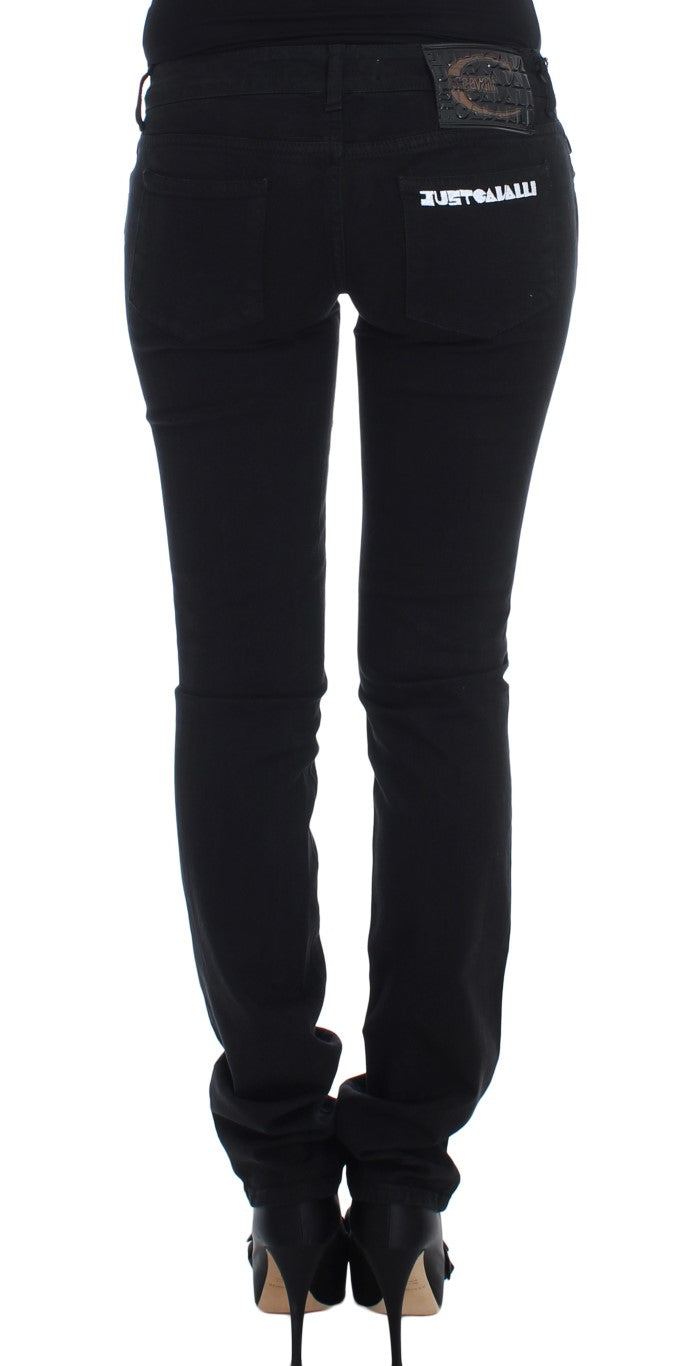 Black cotton stretch slim skinny fit jeans from the back with white lettering on the pocket