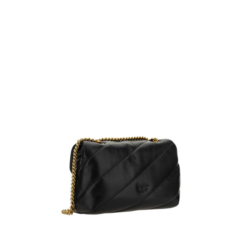 Black quilted leather shoulder bag with diagonal stitching and a gold chain strap