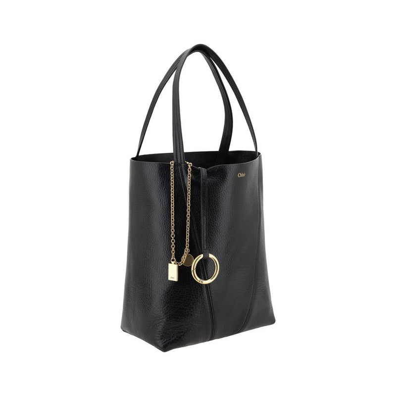 Black leather shoulder bag with gold chain charm and dual top handles