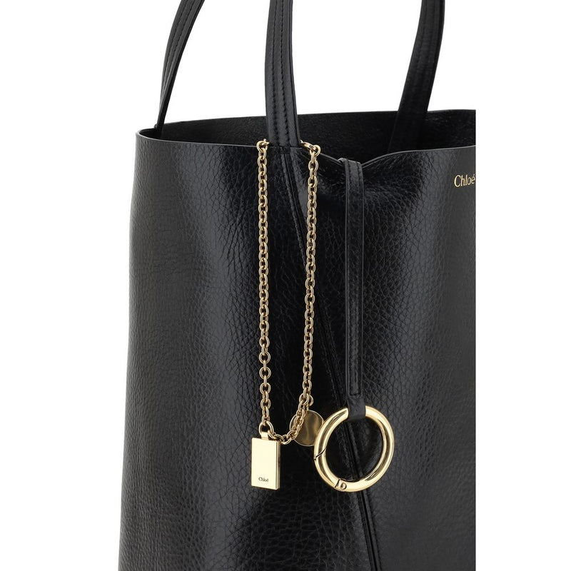 Black leather shoulder bag with gold-tone hardware and chain detail