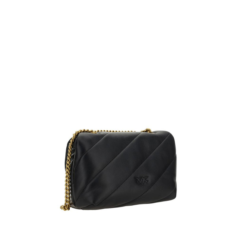 Black quilted leather shoulder bag with diagonal stitching and a gold chain strap
