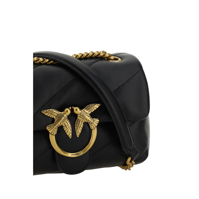 Black quilted leather shoulder bag with gold chain strap and interlocking bird clasp