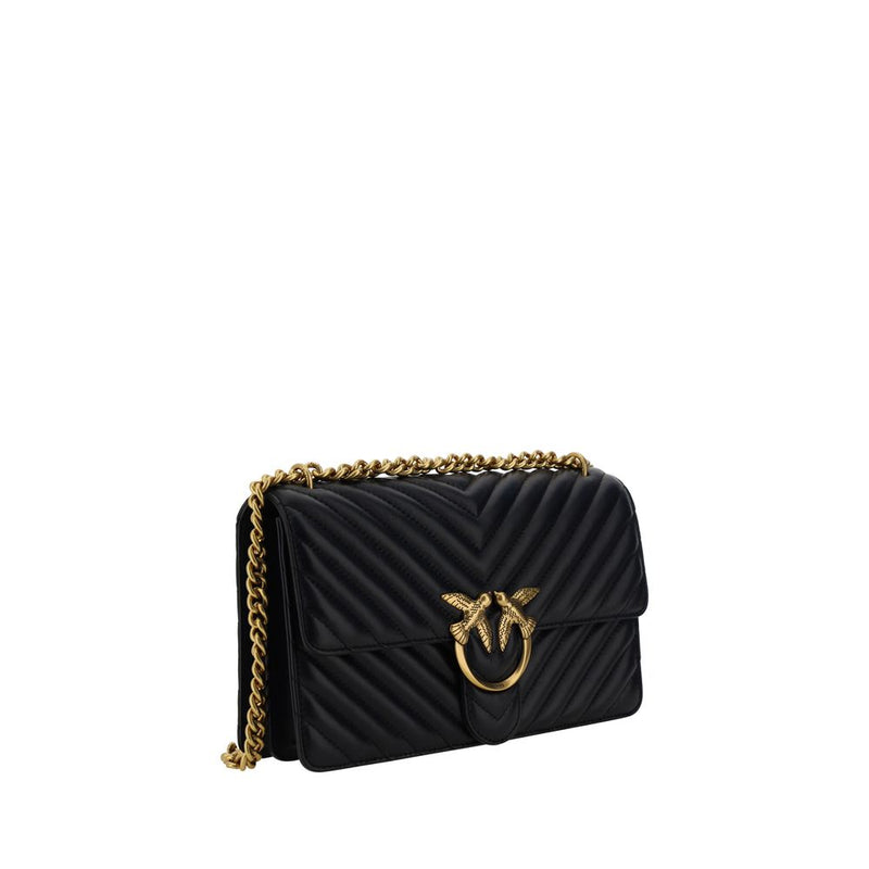 Black quilted leather shoulder bag with gold chain strap and metal bird clasp