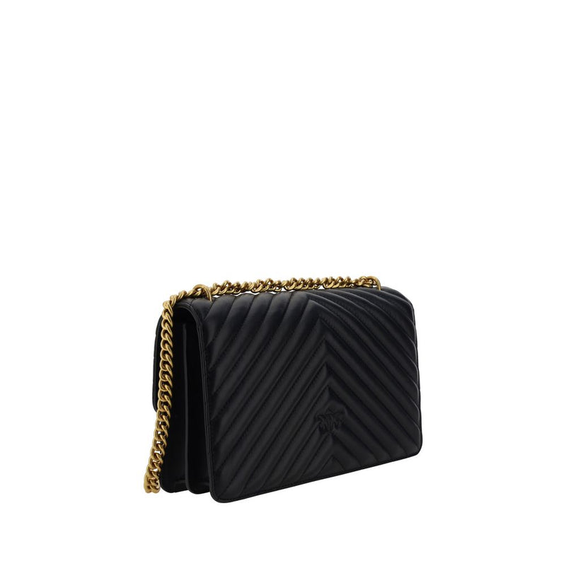 Black quilted leather shoulder bag with chevron pattern and gold chain strap