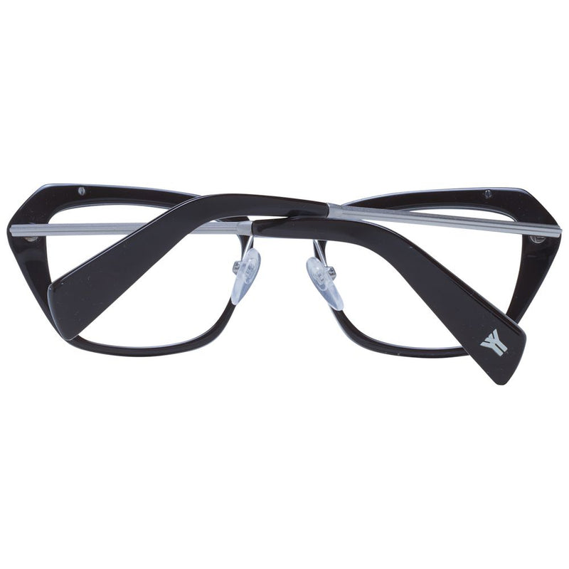 Yohji Yamamoto black and silver metal and plastic eyeglass frames folded against a white background