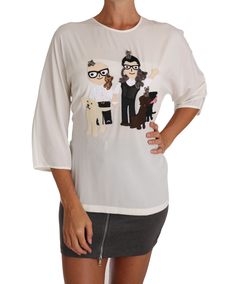 White silk crew neck blouse with short sleeves and a family graphic applique