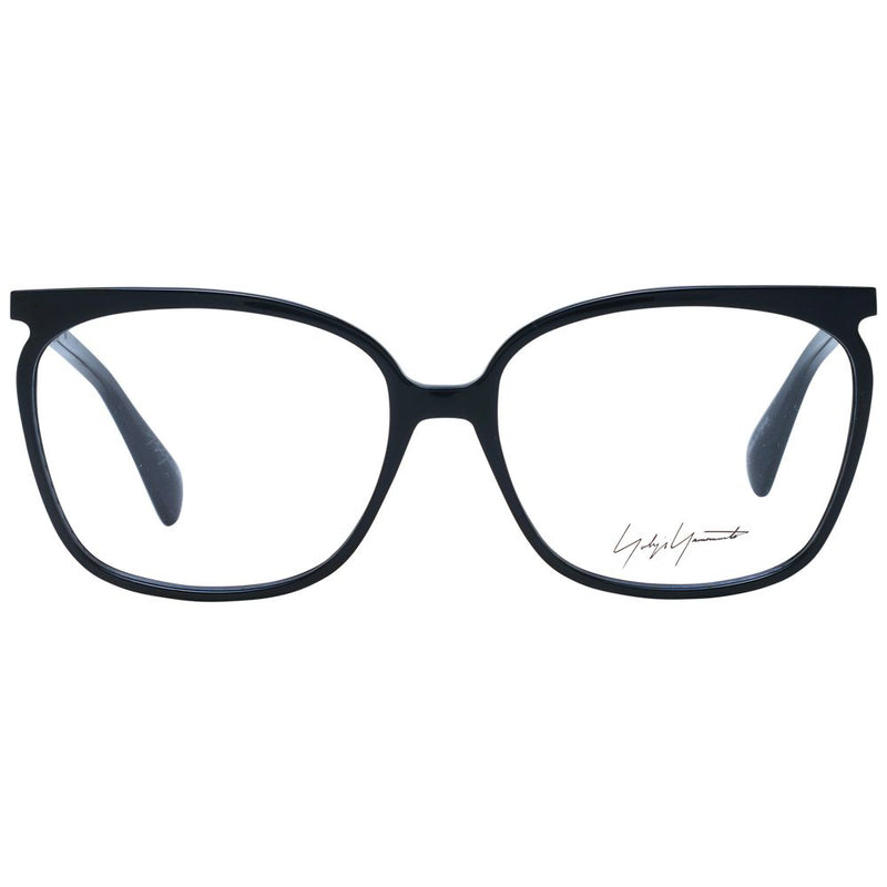 Black acetate eyeglass frames with rounded rectangular lenses and a designer signature on the right lens