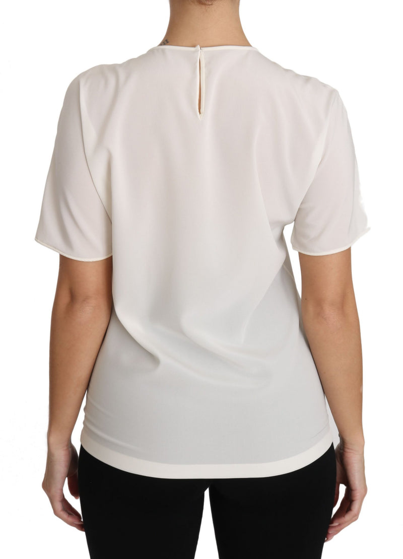 White silk short-sleeve T-shirt worn from behind showing back keyhole detail