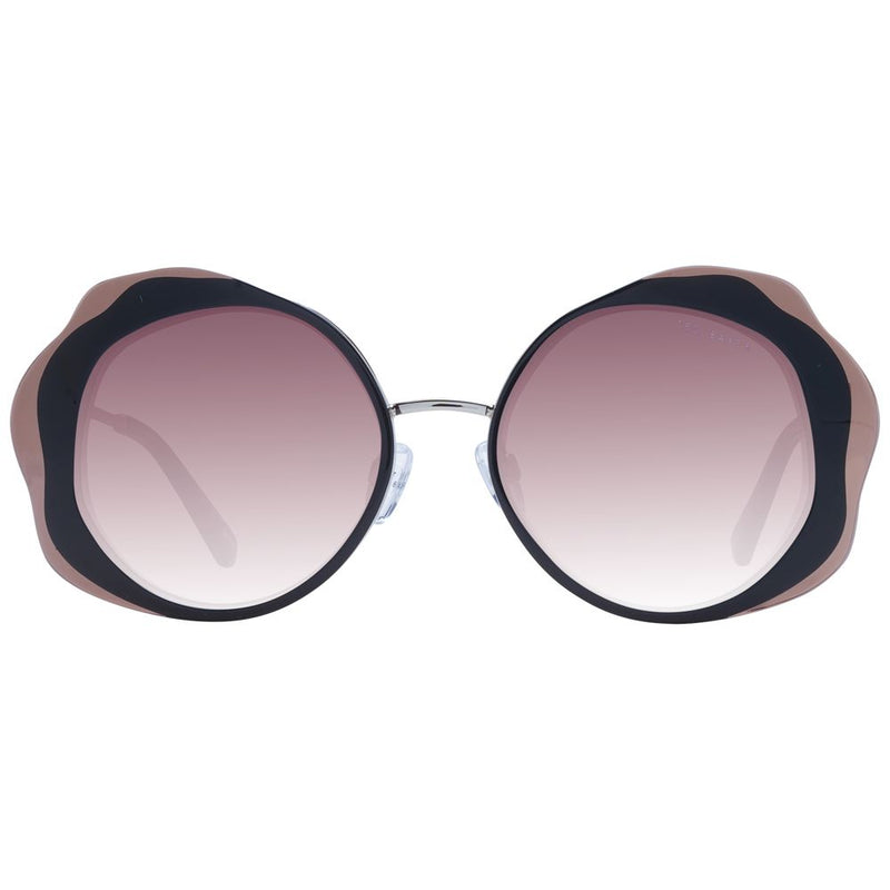 Black and nude acetate sunglasses with large round frames and gradient lenses