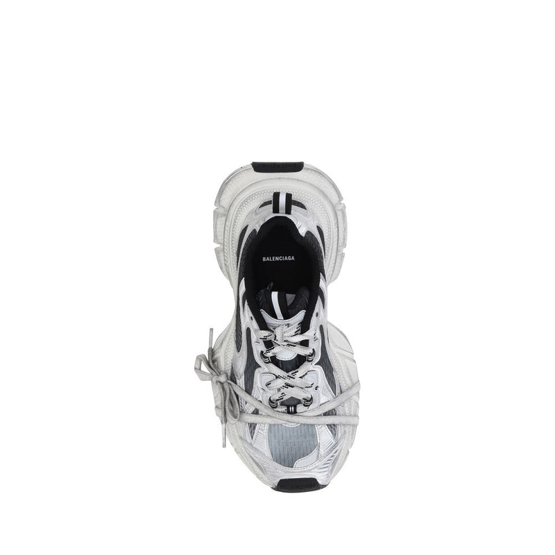 Balenciaga black and silver polyethylene athletic sneakers with chunky sole, layered panels, and wrapped cord laces.