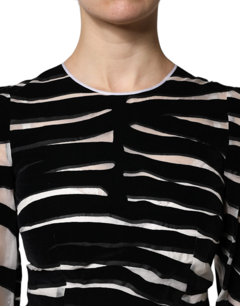 Black and white zebra print velvet mini dress with a round neckline