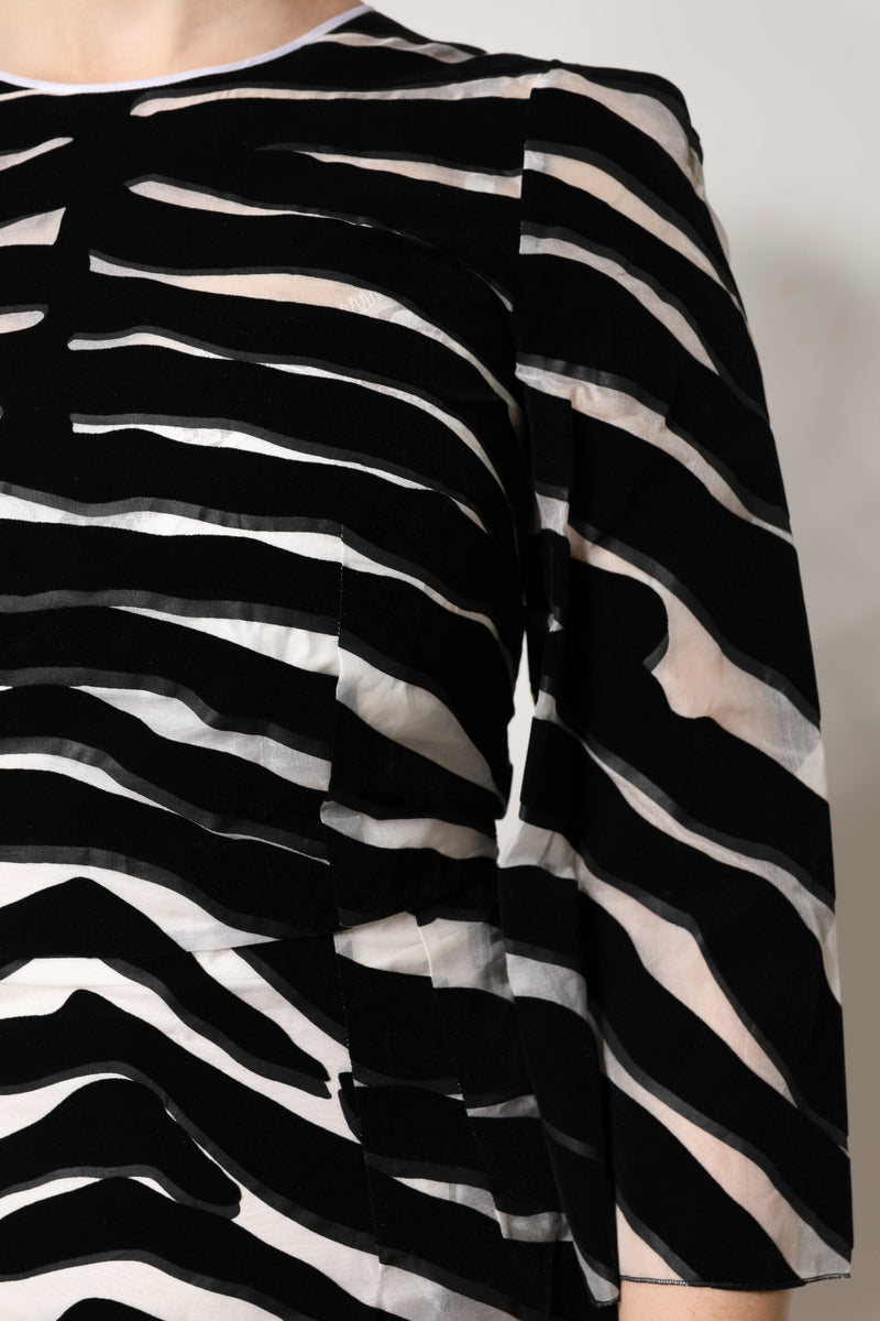 Black and white zebra print velvet sheath mini dress with long sleeves