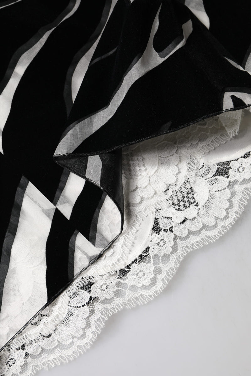 Black and white zebra print silk dress with white lace hem detail