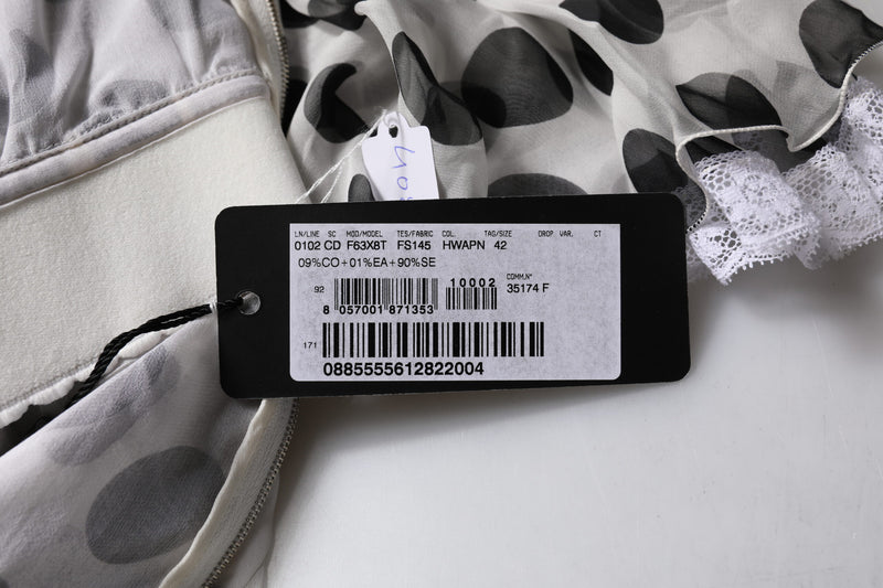 Dolce & Gabbana white polka dotted silk blend dress label and fabric close up