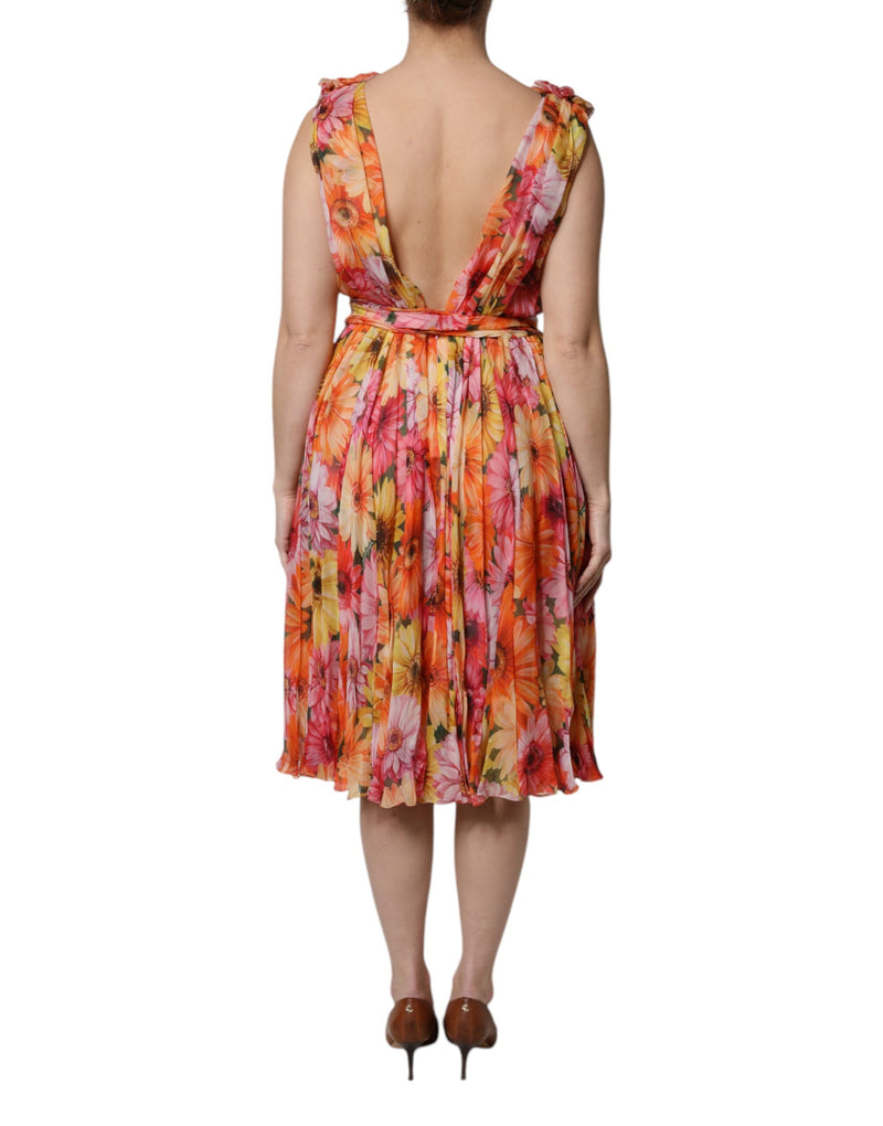 Multicolor floral silk chiffon dress with a low V-back and flared knee-length skirt worn from the back