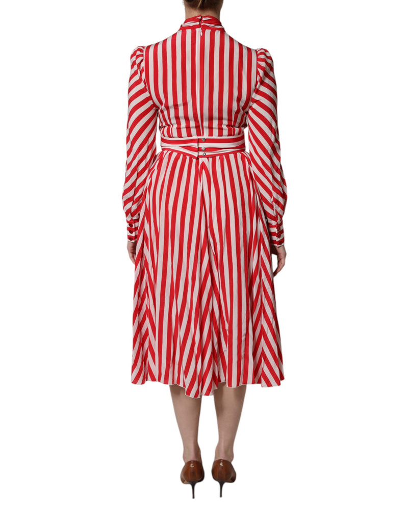 White and red striped silk long sleeve midi dress with a high collar and flared skirt
