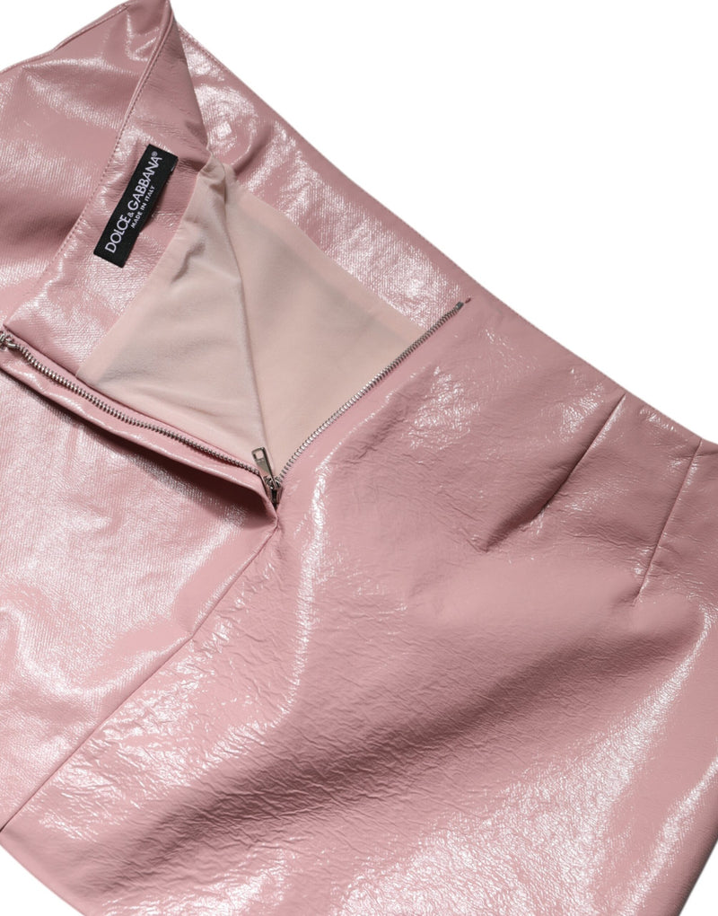 Glossy pink high-waist mini skirt with a partially unzipped back zipper and Dolce & Gabbana brand label