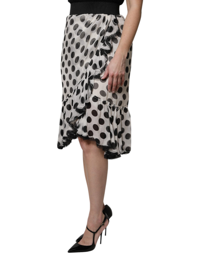 White knee-length silk skirt with black polka dots and black lace ruffles