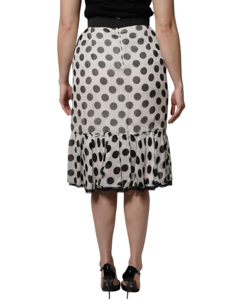 White and black polka dot silk knee-length skirt with a ruffled hem
