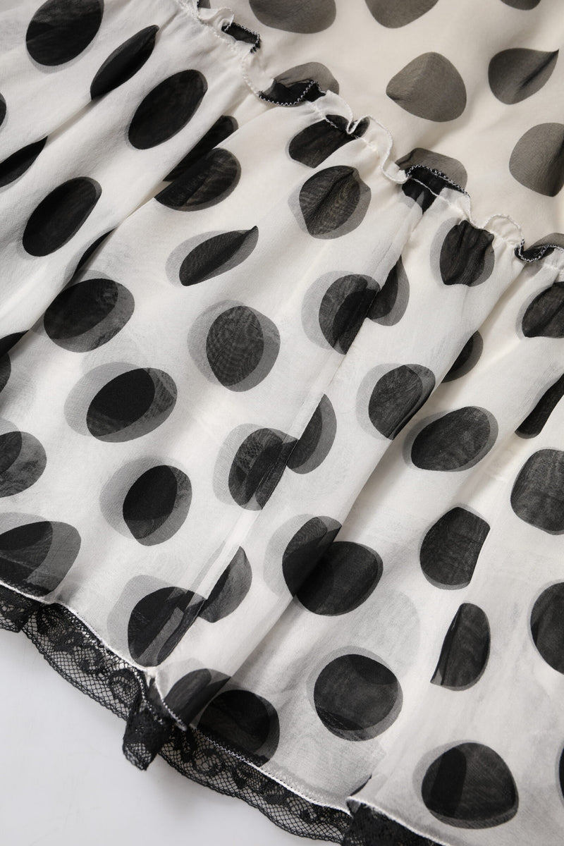 White sheer silk skirt with black polka dots and lace trim