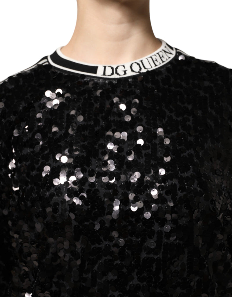 Black sequin pullover sweater with white striped ribbed collar reading DG QUEEN