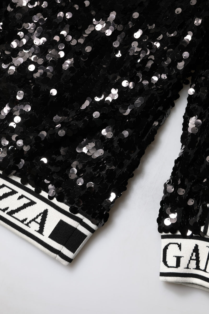 Black sequin pullover sweater with white and black knit ribbed trim