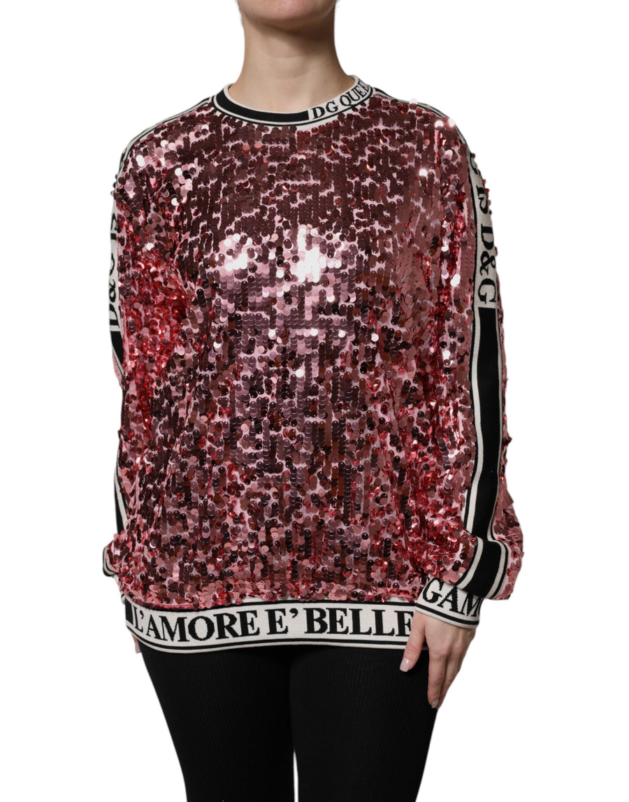 Pink sequin pullover sweater with black and white striped trim on the collar, cuffs, and hem