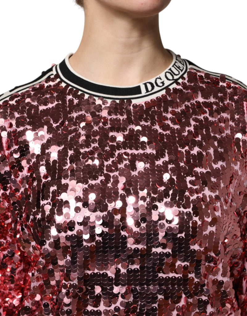 Pink sequin pullover sweater with black and white striped collar and DG Queen text