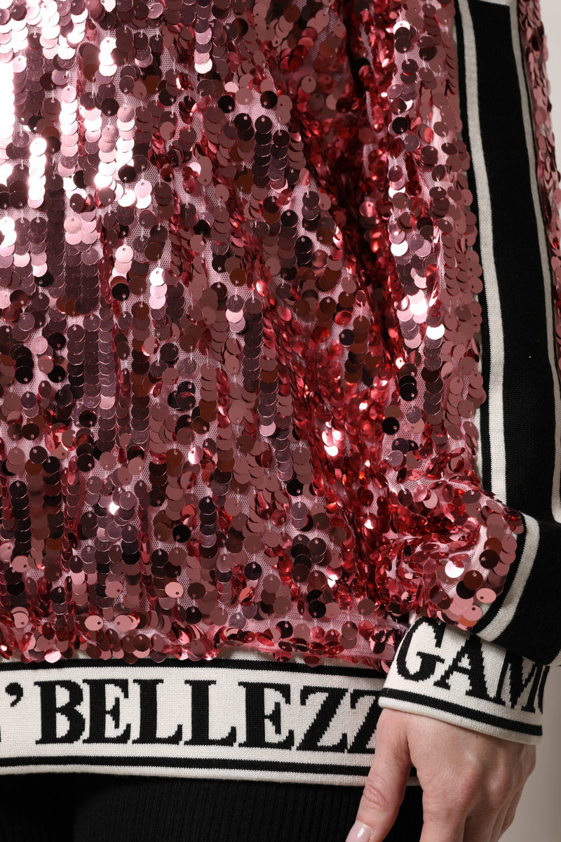 Pink sequin pullover sweater with black and white striped trim