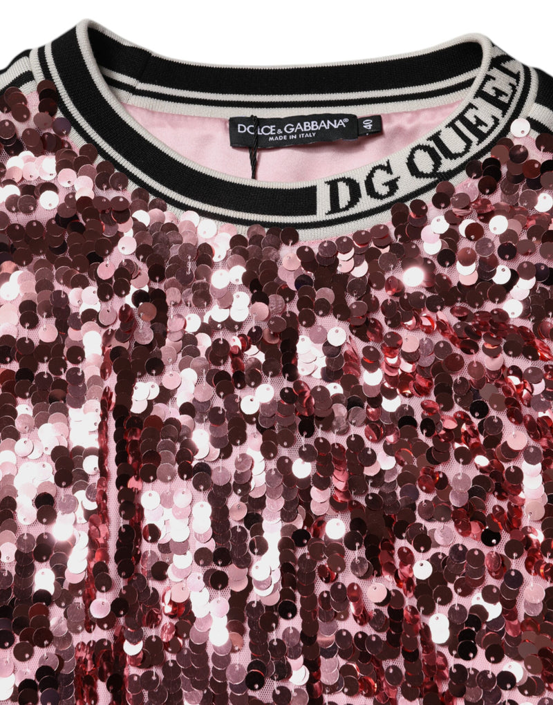Pink sequin pullover sweater with black and white striped collar and DG Queen text