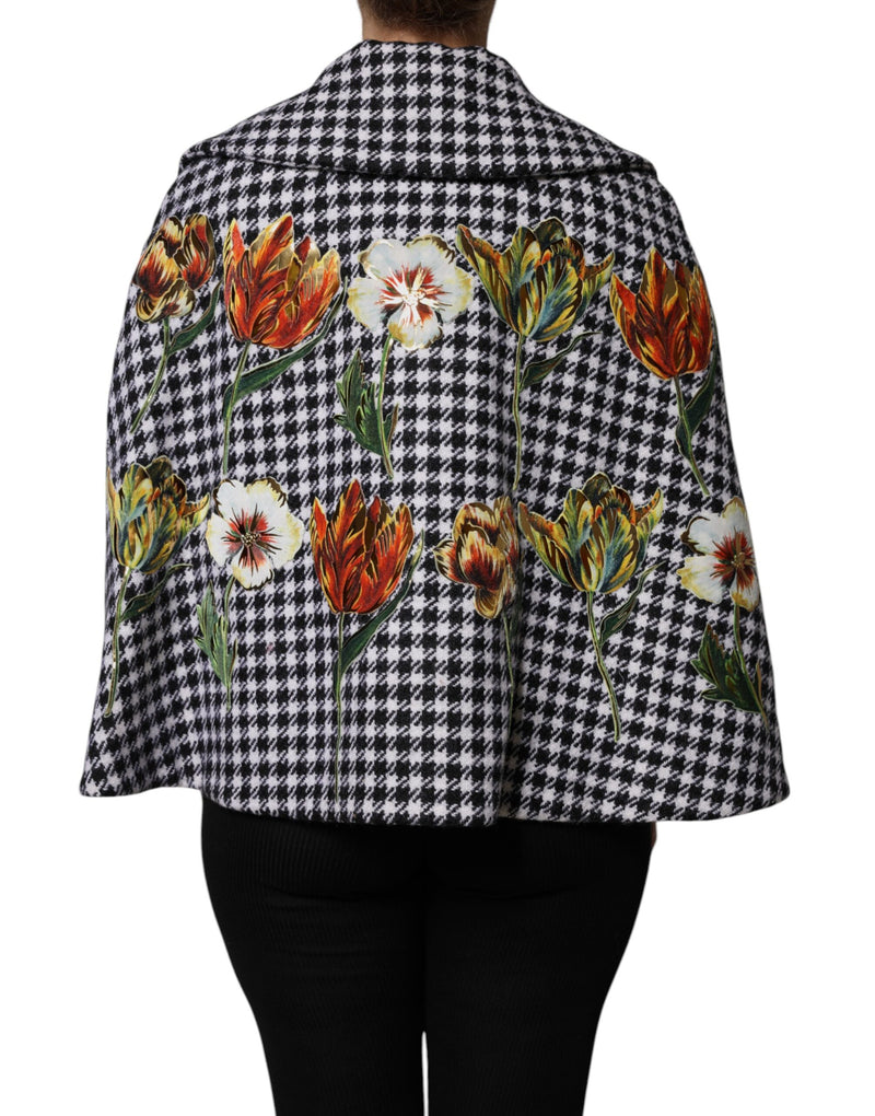 Black and white houndstooth cape jacket with colorful embroidered tulip florals worn from behind