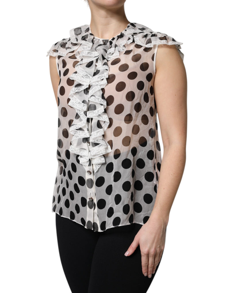 White sheer cotton sleeveless top with black polka dots and ruffled lace trim