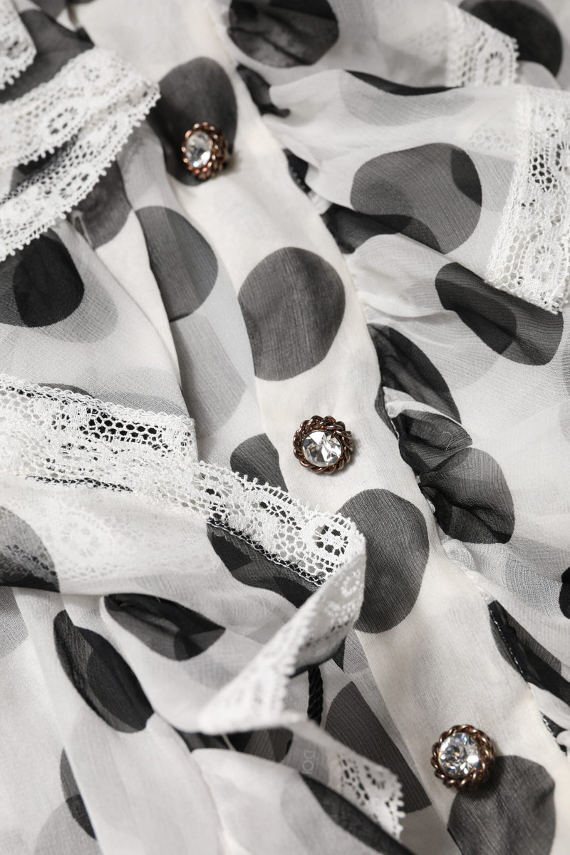 White and black polka dot cotton sleeveless top with lace trim and jeweled crystal buttons
