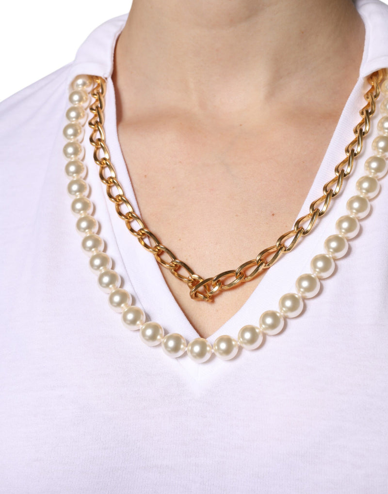 White cotton t-shirt with a V-neck, featuring layered pearl and gold chain necklaces