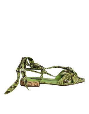Dolce & Gabbana green snake-print leather flat sandal with ankle-tie laces and a woven tan textured heel.