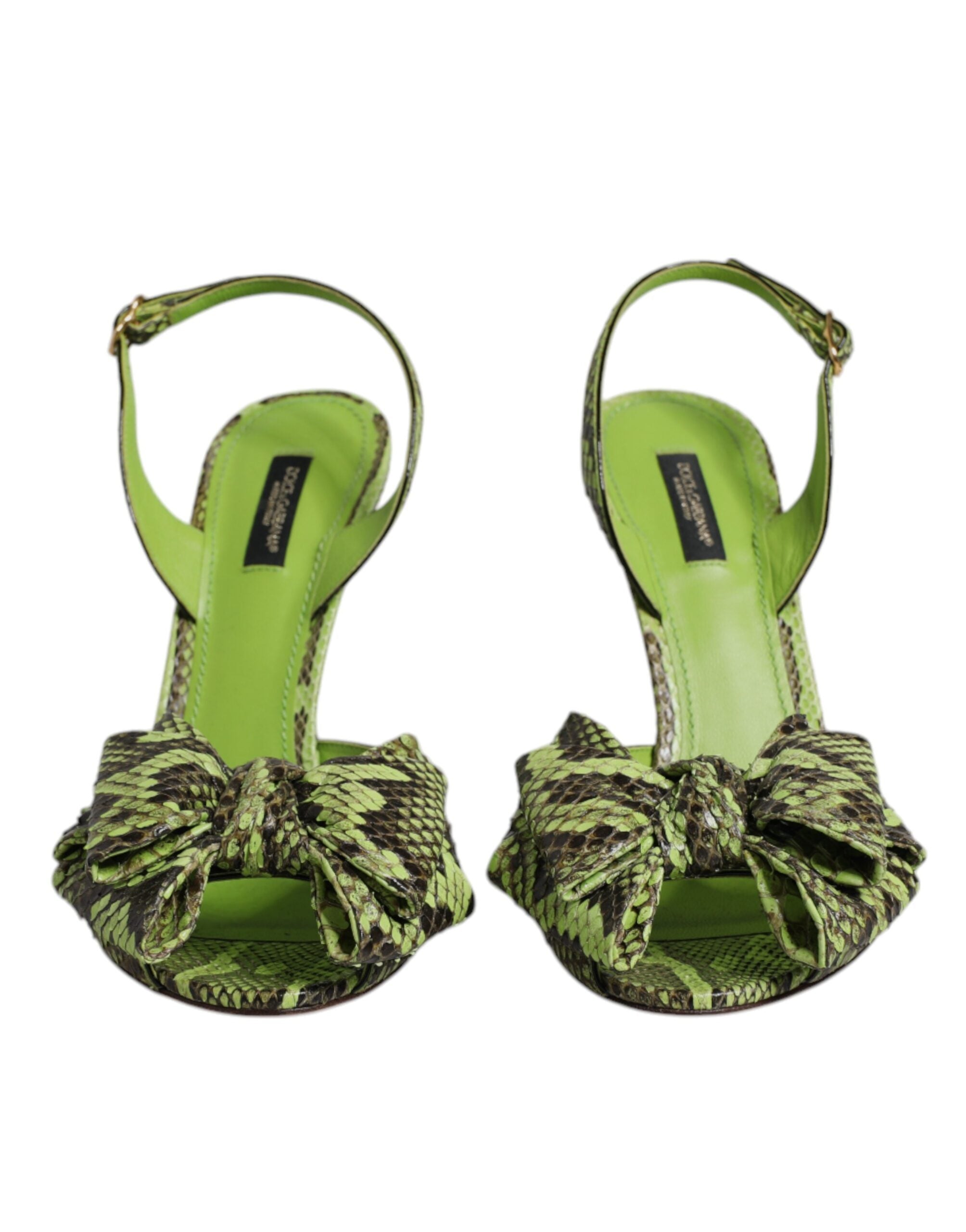 Dolce & Gabbana neon green python-skin slingback heels with a large bow detail on the open toe.